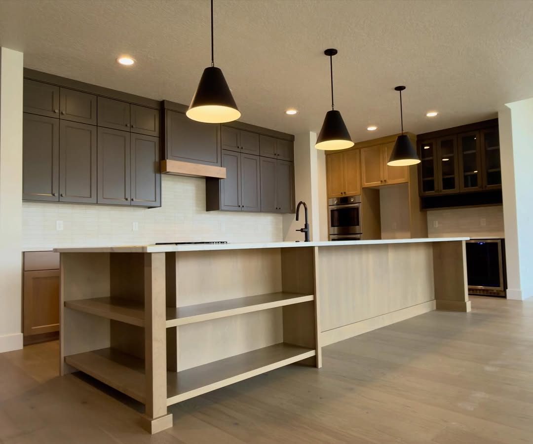 Custom kitchen with dark island — M & M Cabinetry Naples FL